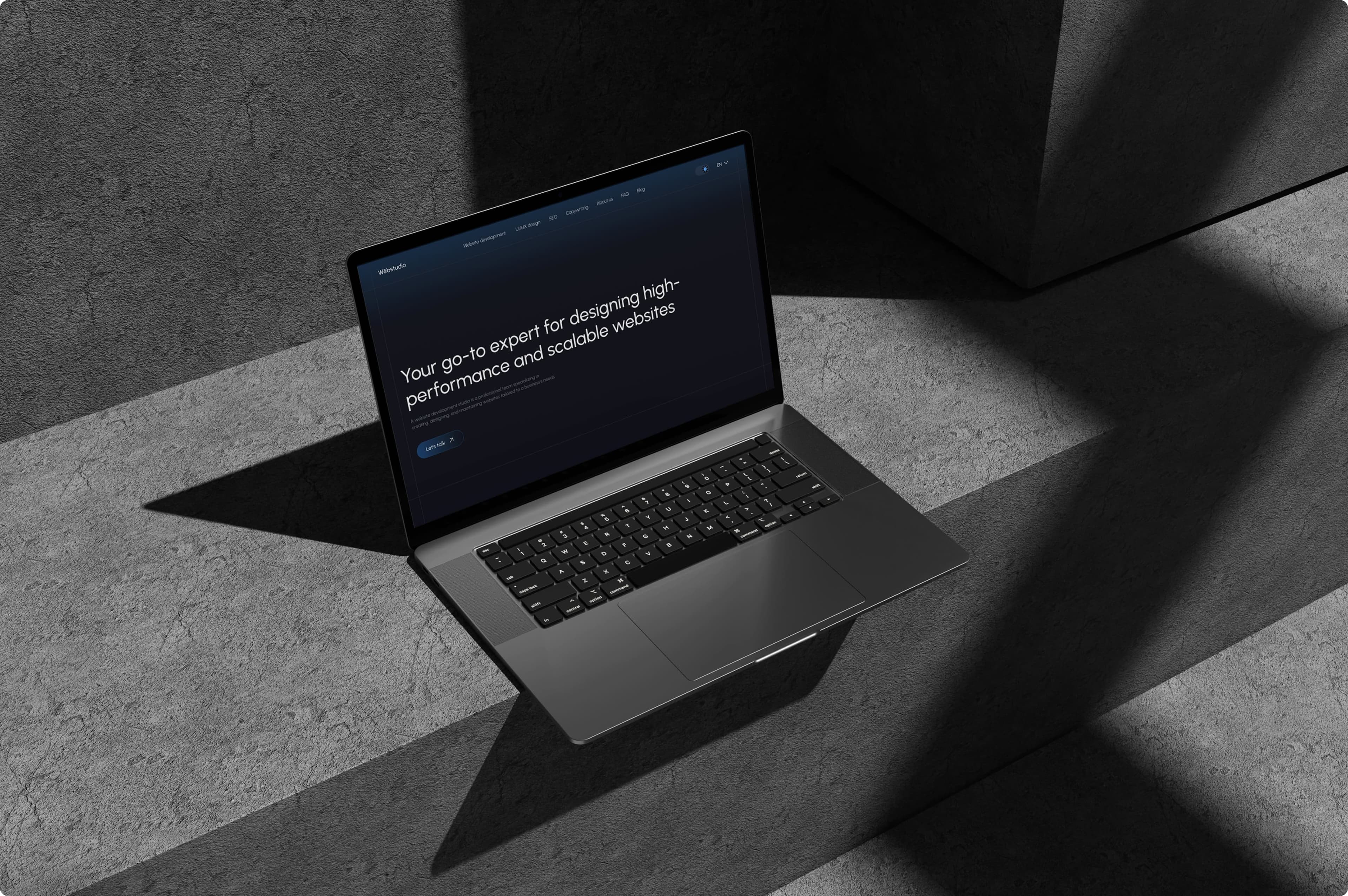 Side view of an open laptop with a website on the screen